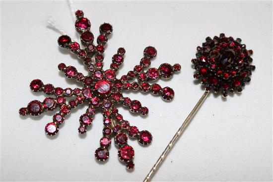 A garnet brooch and similar hat pin.